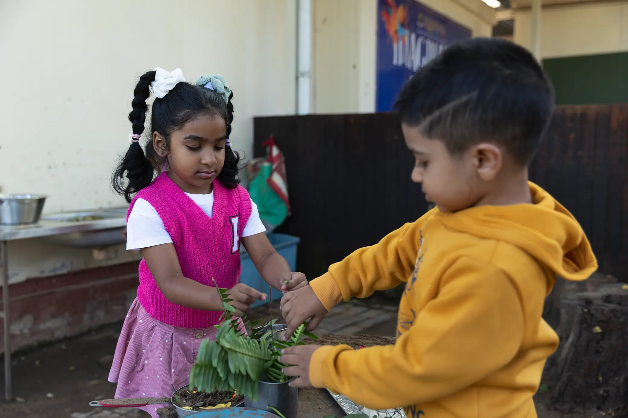 Children planting and learning outdoors at Summerhill