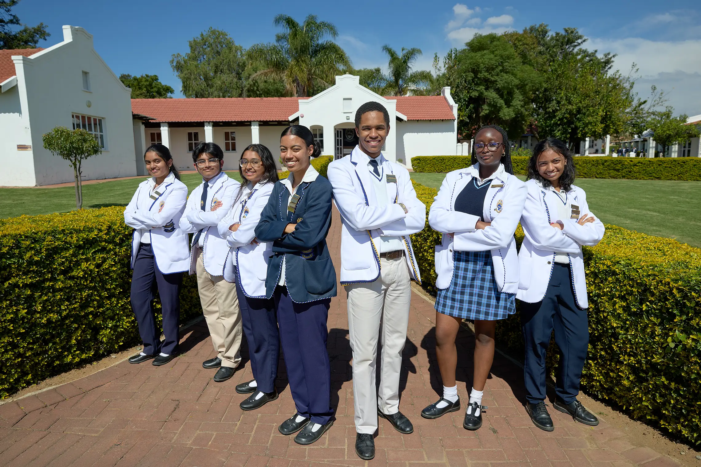 A group of Summerhill students standing together on campus