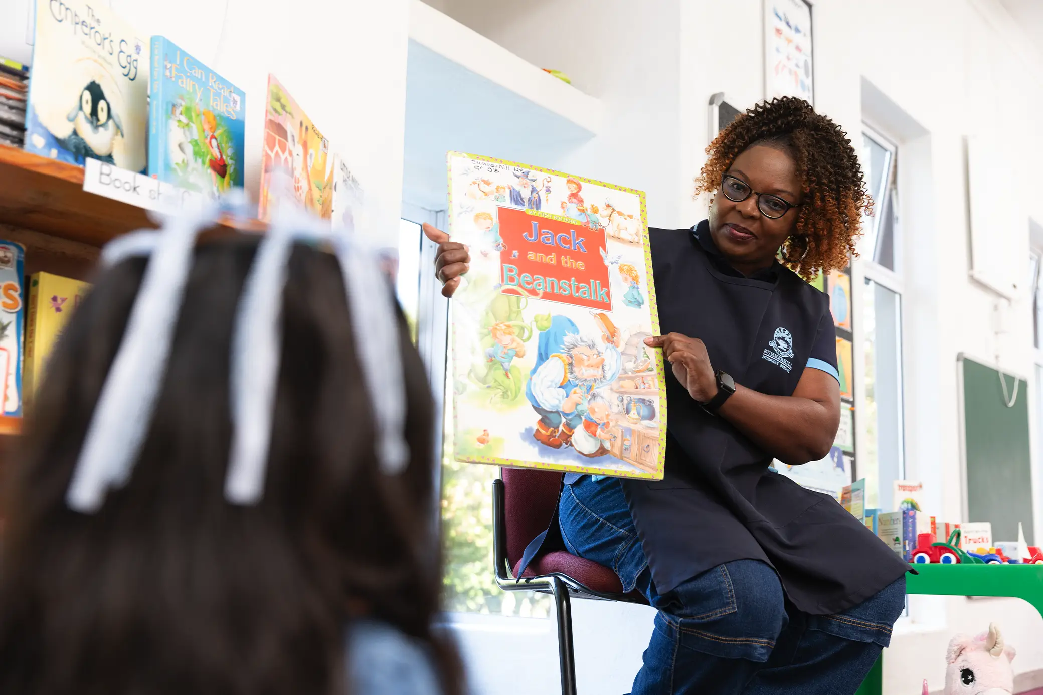Teacher reading to children at Summerhill Nursery
