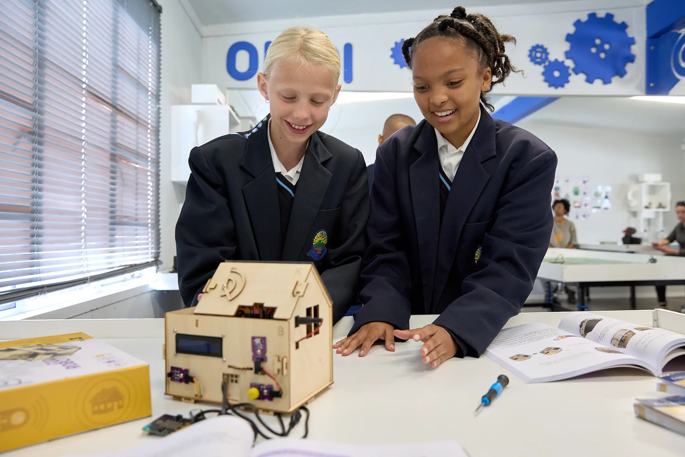 Summerhill students collaborating on an engineering project